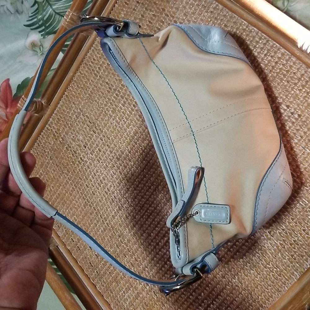 Coach Baby blue and cream colored mini bag.